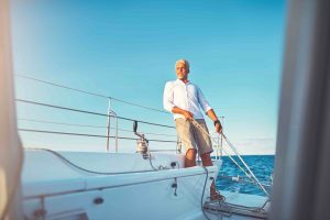 Man with new boat after Boat Loan